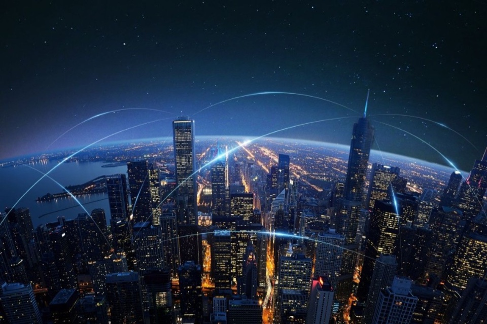 City skyline at night with glowing network connections between buildings